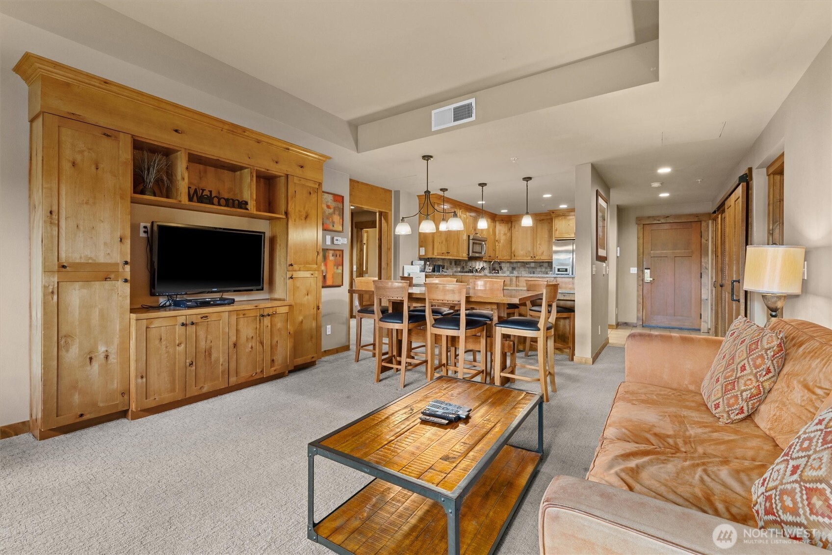3770 Suncadia Trail, Unit 102 Cle Elum, WA 98922 - Photo 14 of 35 a living room with furniture and a flat screen tv
