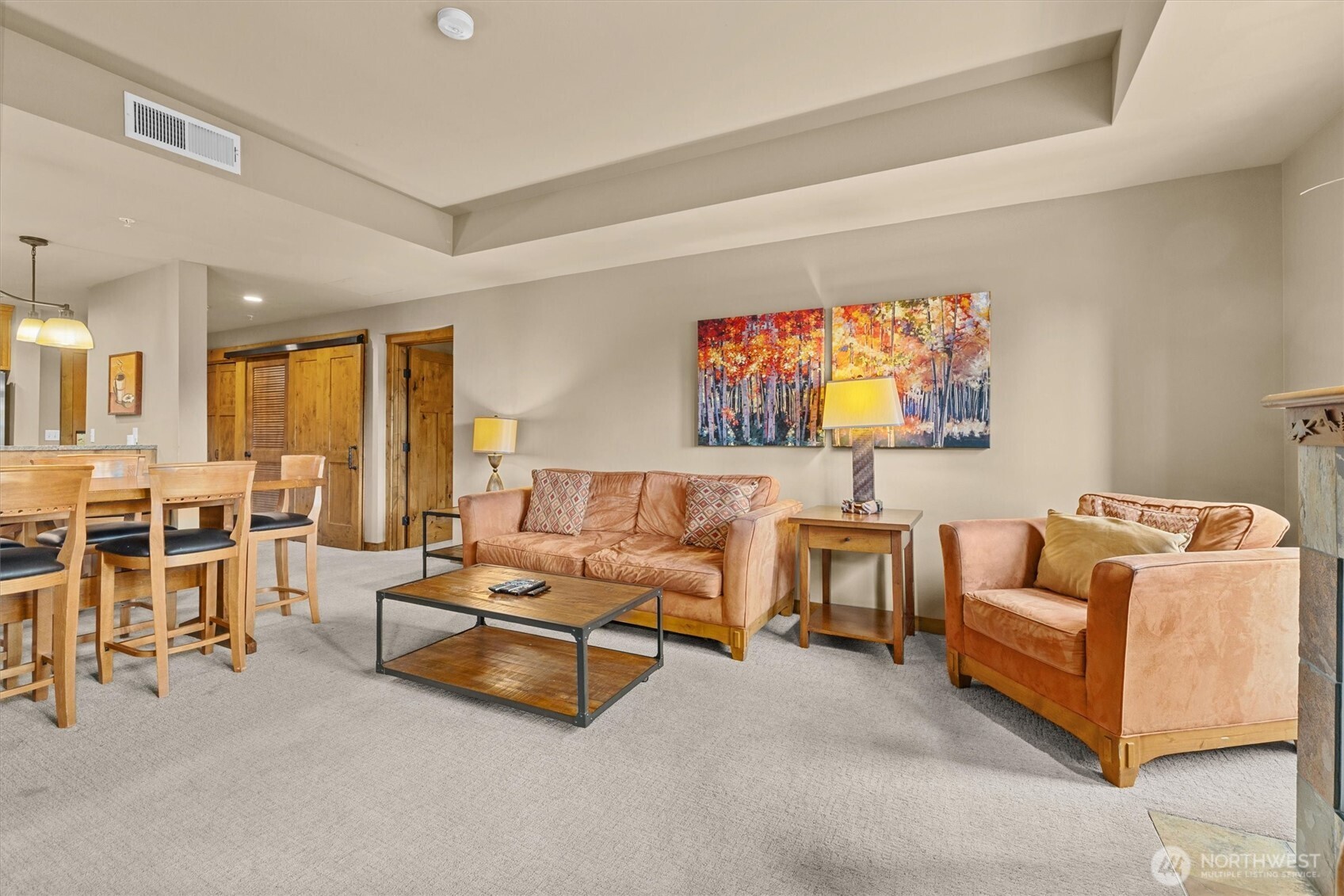 3770 Suncadia Trail, Unit 102 Cle Elum, WA 98922 - Photo 15 of 35 a living room with furniture and a flat screen tv