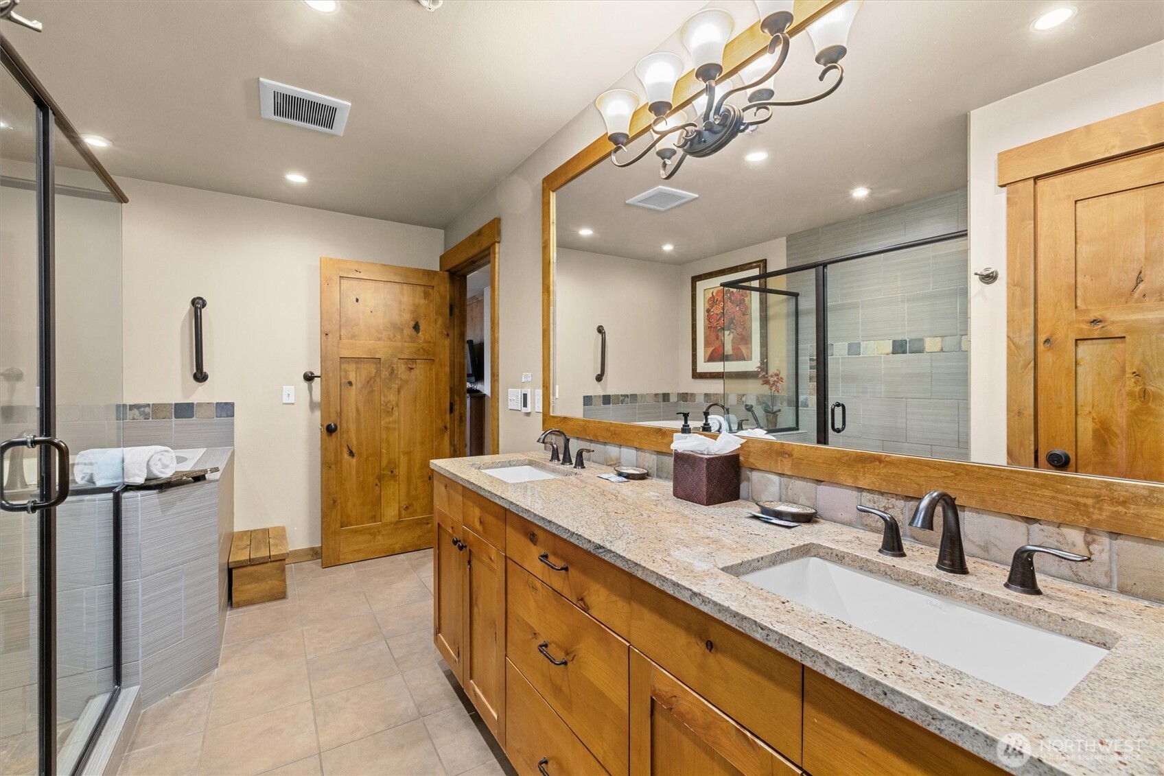 3770 Suncadia Trail, Unit 102 Cle Elum, WA 98922 - Photo 23 of 35 a bathroom with double vanity sinks a shower and a mirror