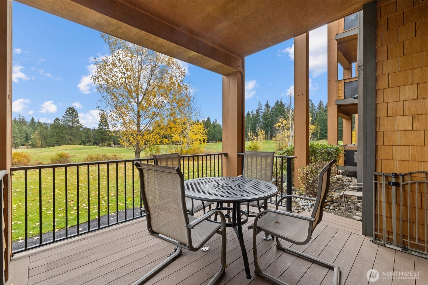3770 Suncadia Trail, Unit 102 Cle Elum, WA 98922 - Photo 29 of 35 a view of a balcony with furniture and wooden floor