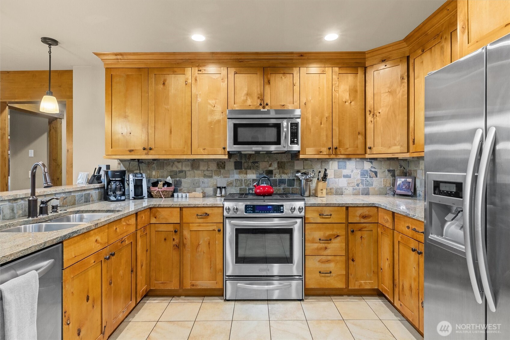 3770 Suncadia Trail, Unit 102 Cle Elum, WA 98922 - Photo 5 of 35 a kitchen with stainless steel appliances granite countertop a stove sink and cabinets