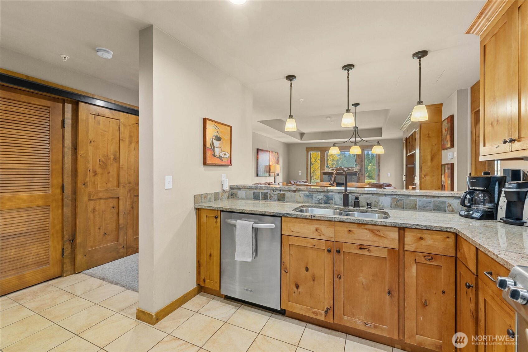 3770 Suncadia Trail, Unit 102 Cle Elum, WA 98922 - Photo 8 of 35 a large kitchen with stainless steel appliances granite countertop a sink and cabinets