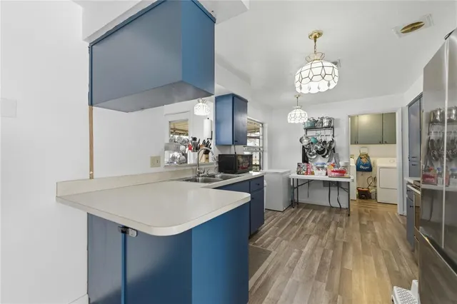 a kitchen with a table and chairs in it