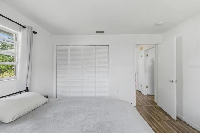 a view of room with window and hallway