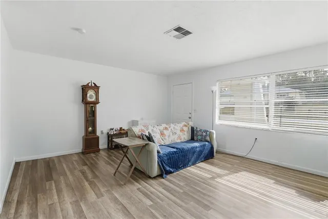 a living room with furniture and a window