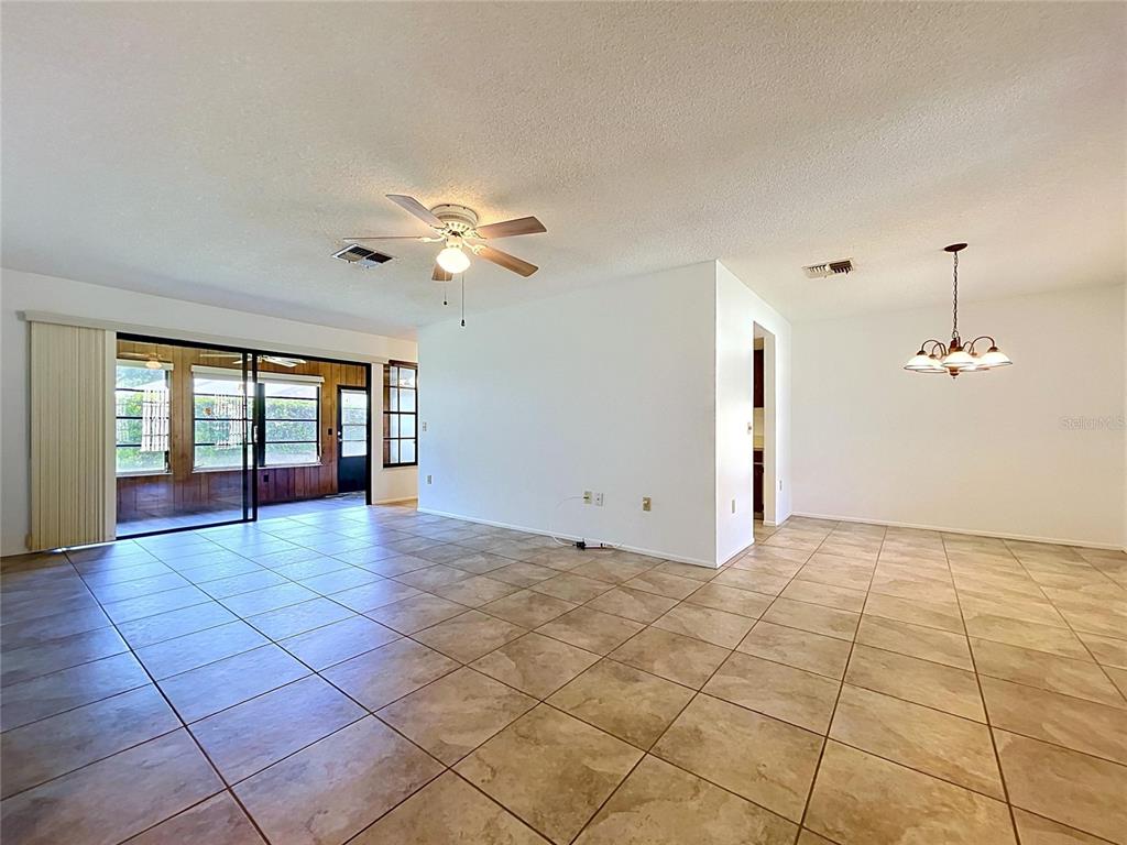 9319 Trowbridge Court New Port Richey, FL 34655 - Photo 18 of 78 a view of an empty room with a window