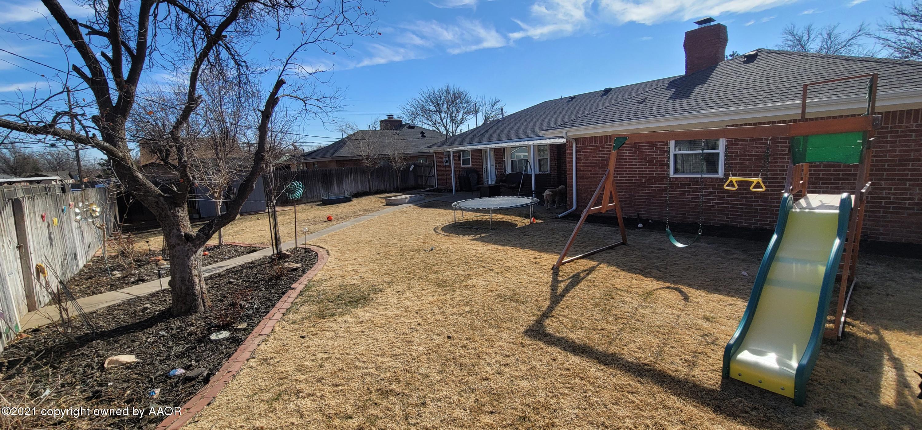 6004 Calumet Road Amarillo, TX 79106 - Photo 33 of 33 a front view of a house with a yard