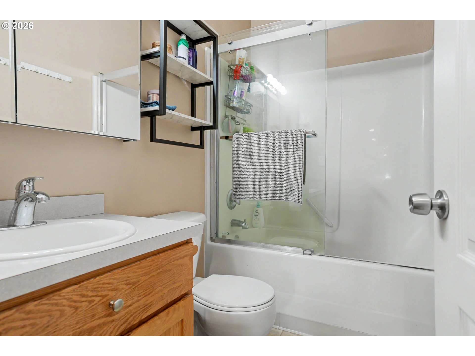 644 Northwest 14th Street Corvallis, OR 97330 - Photo 14 of 23 a bathroom with a sink a toilet and shower