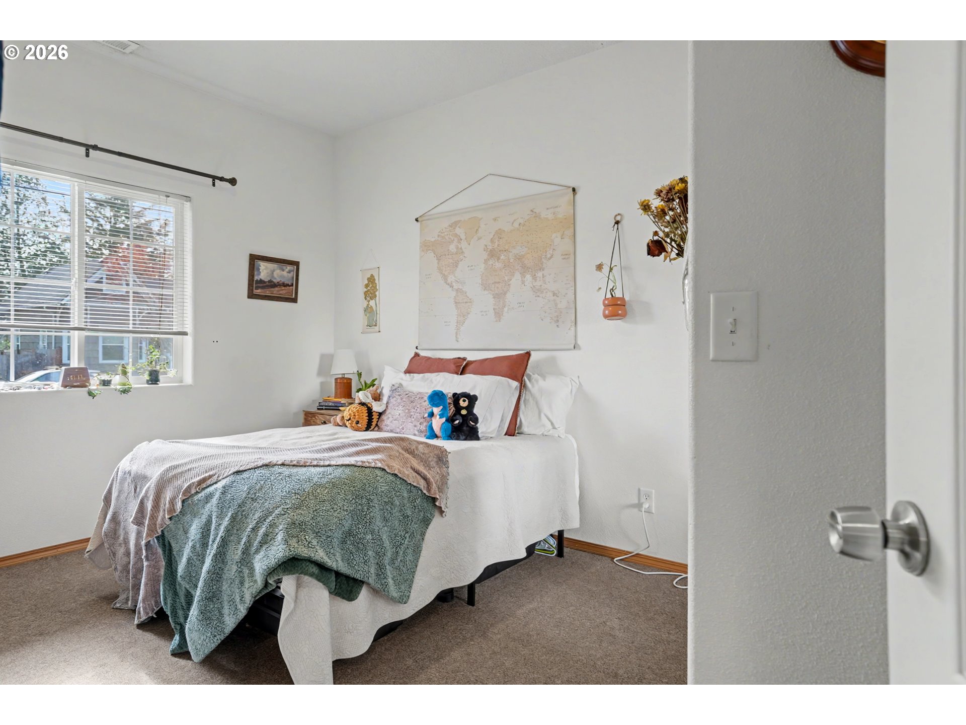 644 Northwest 14th Street Corvallis, OR 97330 - Photo 15 of 23 a bed sitting in a bedroom next to a window