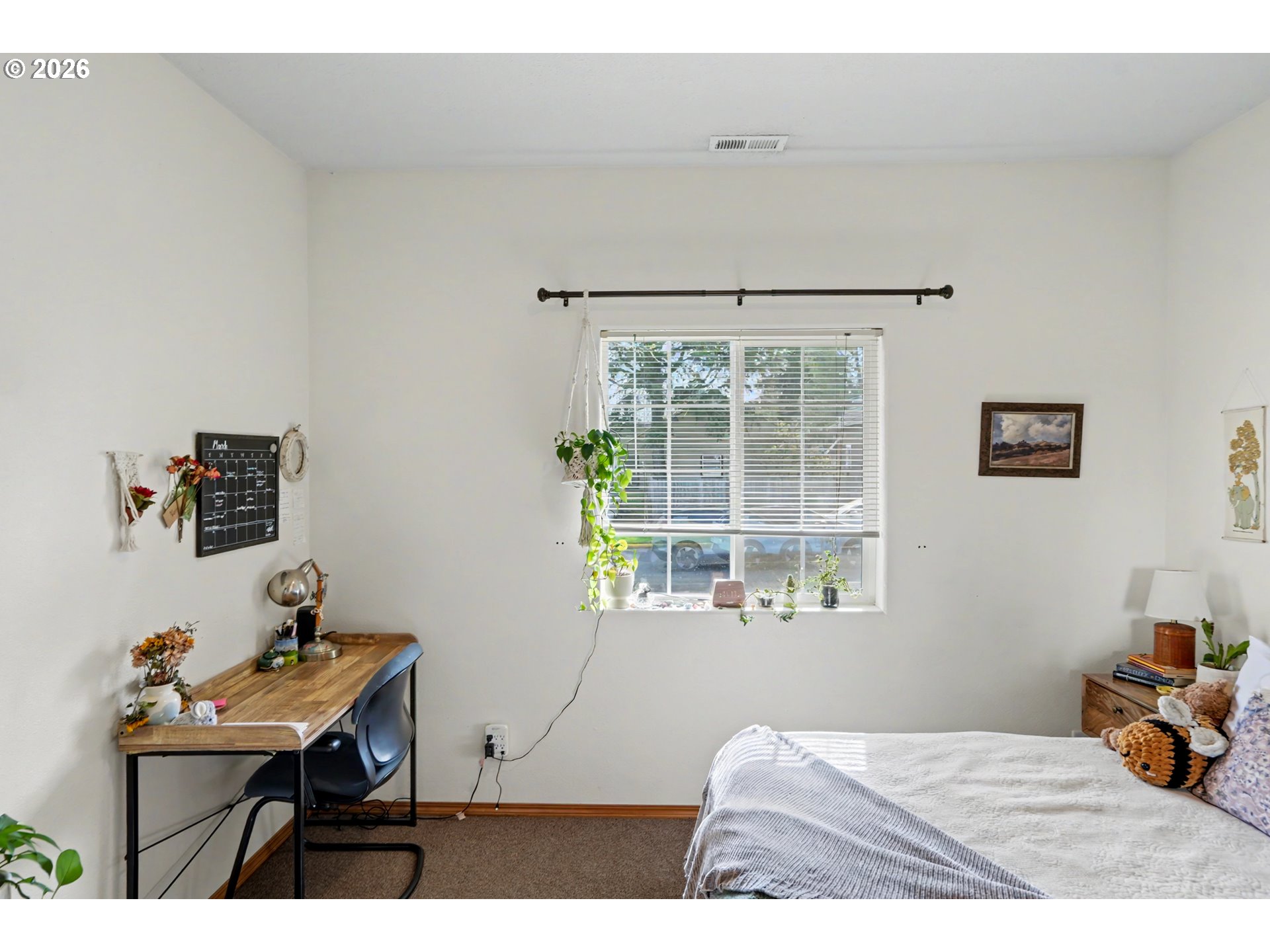 644 Northwest 14th Street Corvallis, OR 97330 - Photo 16 of 23 a bedroom with a bed and a window