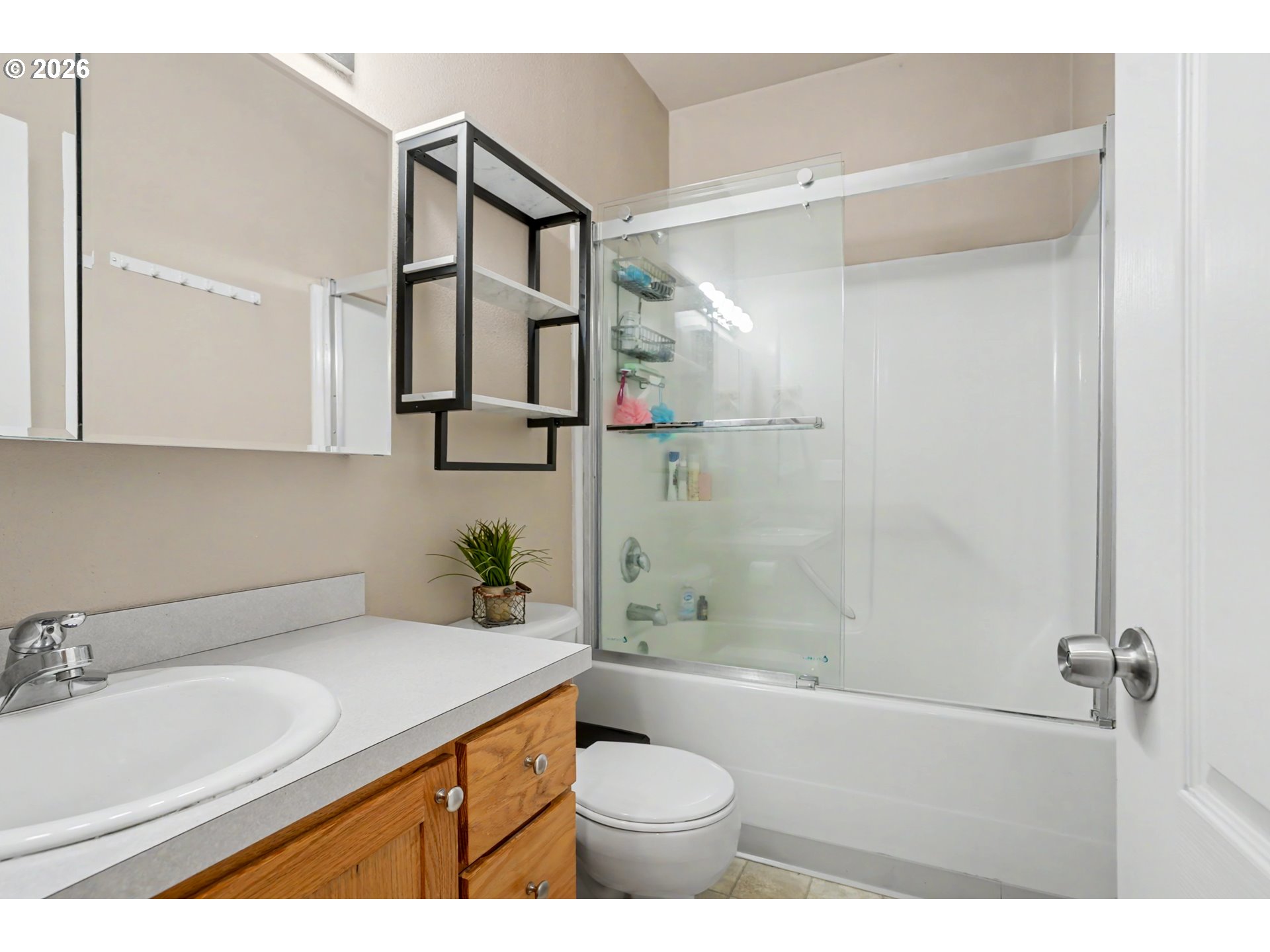 644 Northwest 14th Street Corvallis, OR 97330 - Photo 17 of 23 a bathroom with a granite countertop sink toilet and shower