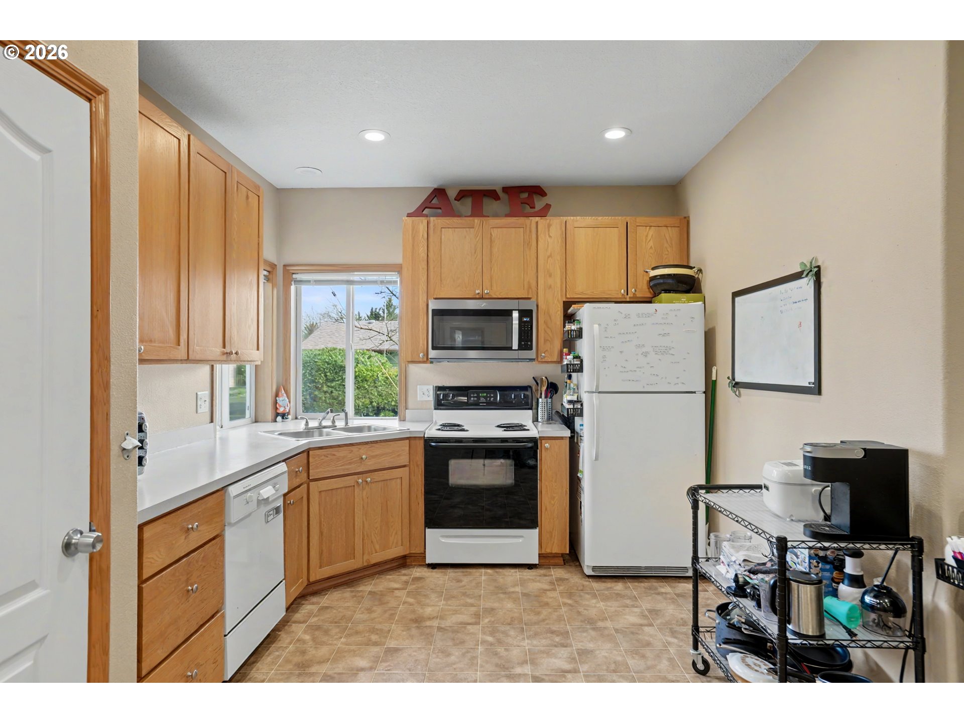 644 Northwest 14th Street Corvallis, OR 97330 - Photo 20 of 23 a kitchen with a refrigerator and a stove top oven