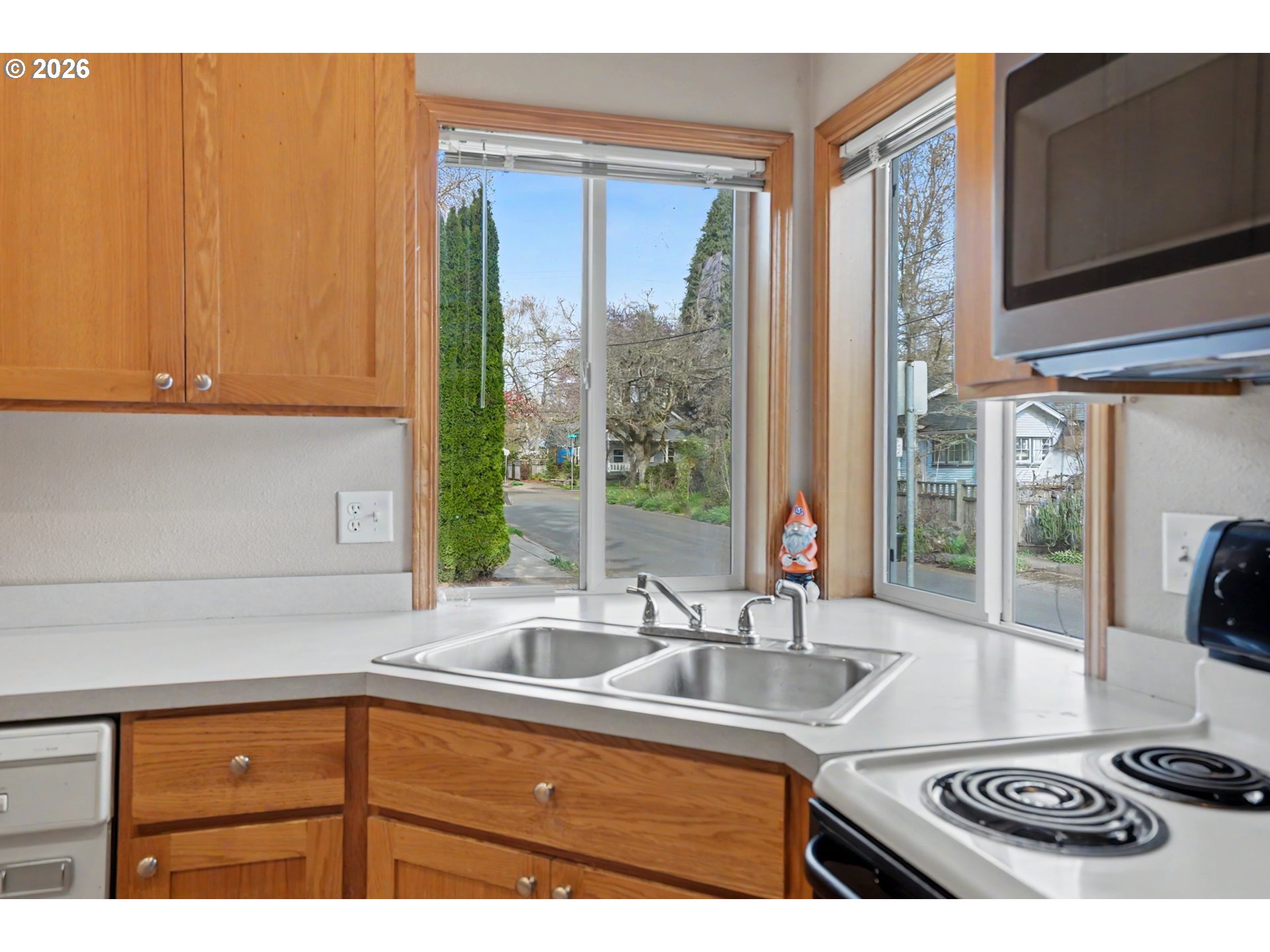 644 Northwest 14th Street Corvallis, OR 97330 - Photo 21 of 23 a kitchen with granite countertop a sink and a window