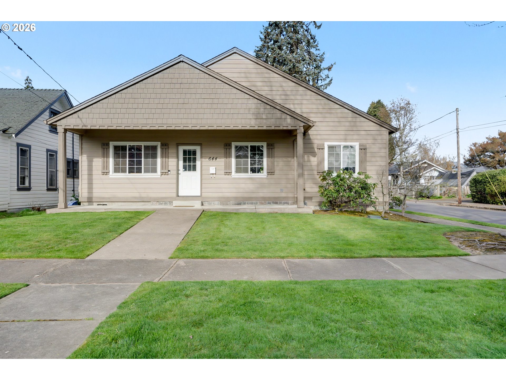 644 Northwest 14th Street Corvallis, OR 97330 - Photo 5 of 23 a front view of a house with a yard