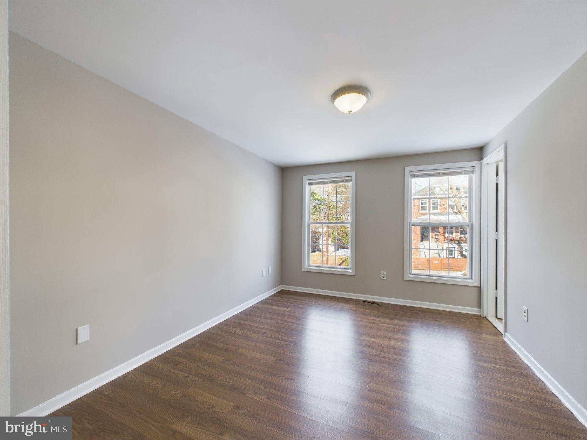 4433 Hunt Place Northeast Washington, DC 20019 - Photo 14 of 25 an empty room with wooden floor and window