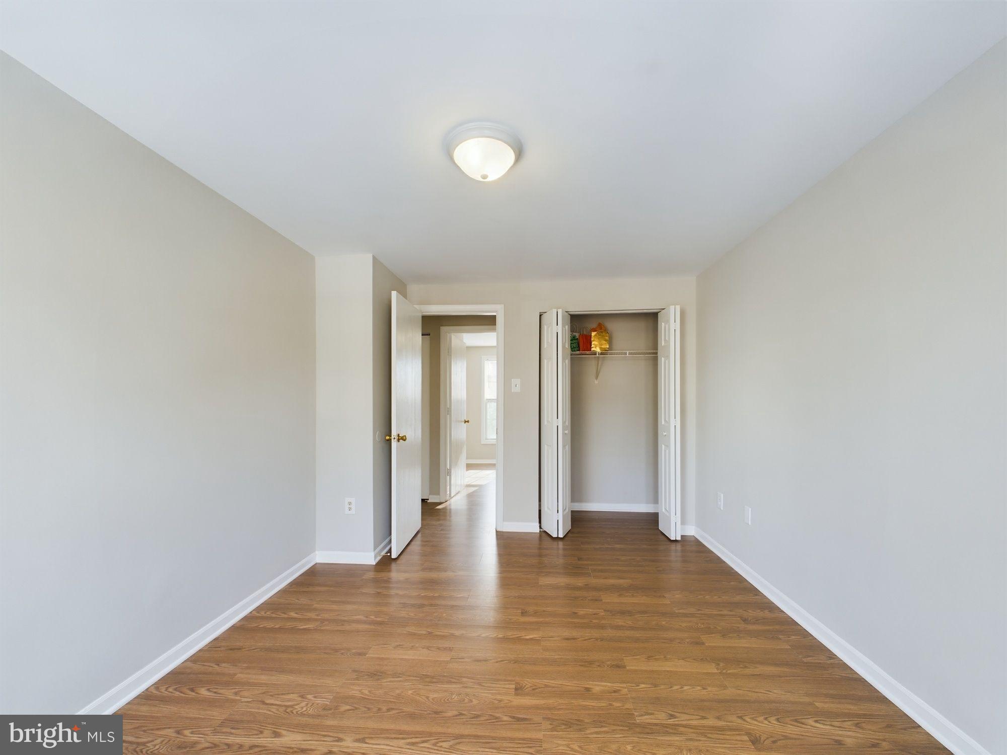 4433 Hunt Place Northeast Washington, DC 20019 - Photo 18 of 25 a view of an empty room with wooden floor and closet