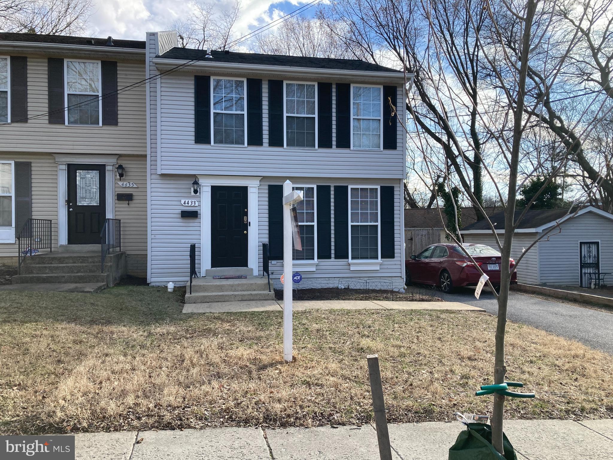 4433 Hunt Place Northeast Washington, DC 20019 - Photo 2 of 25 a house that has a tree in front of it