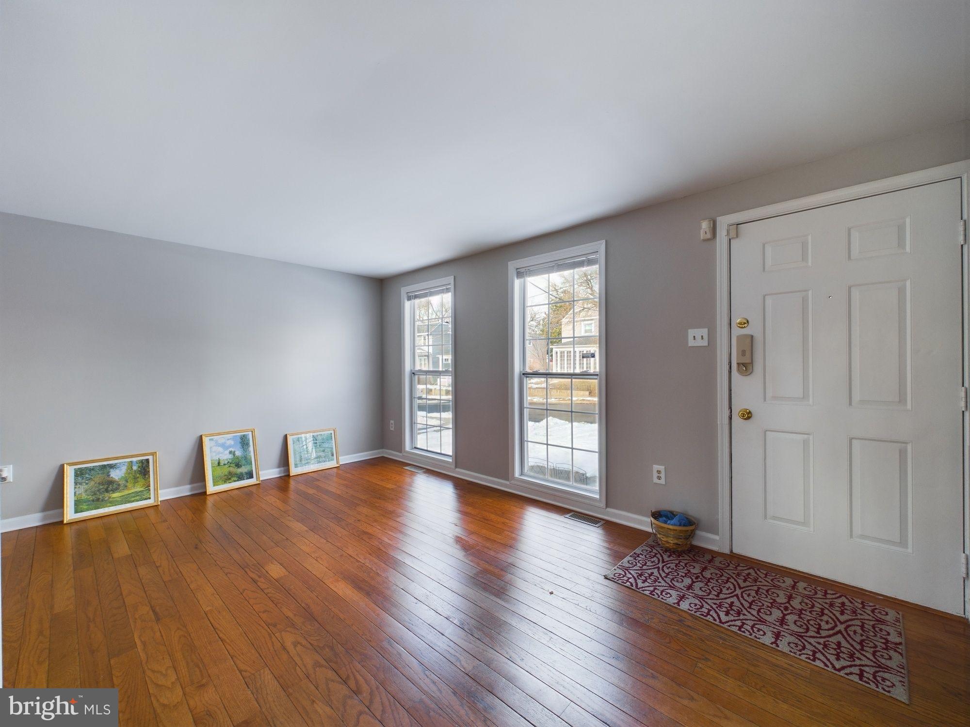 4433 Hunt Place Northeast Washington, DC 20019 - Photo 5 of 25 a view of an empty room with window and wooden floor