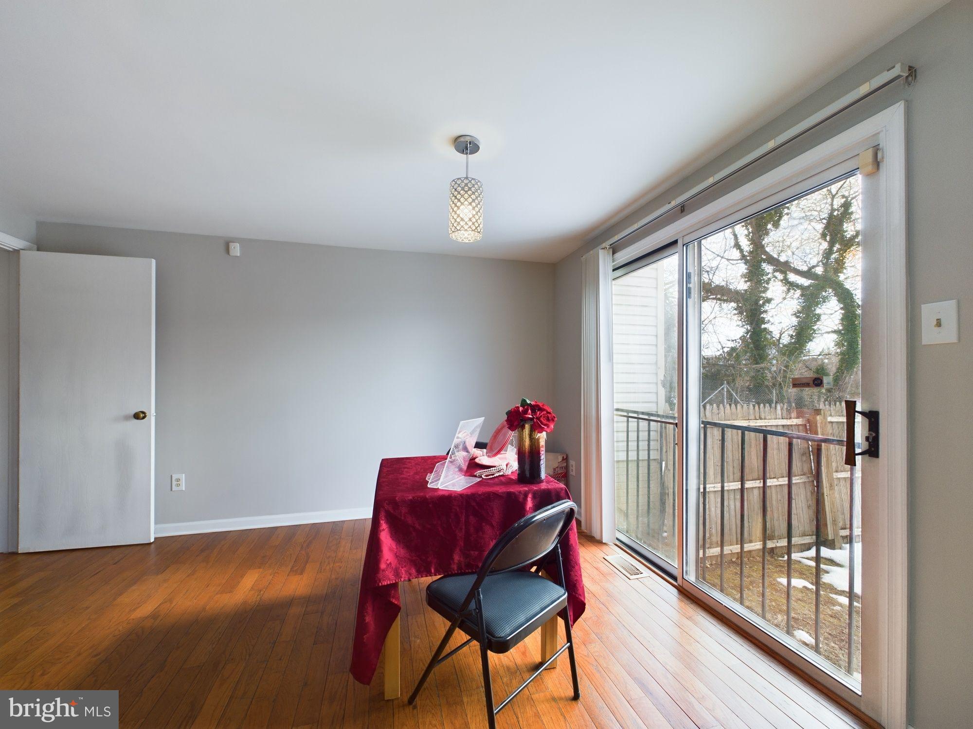 4433 Hunt Place Northeast Washington, DC 20019 - Photo 7 of 25 a view of a room with furniture wooden floor and windows