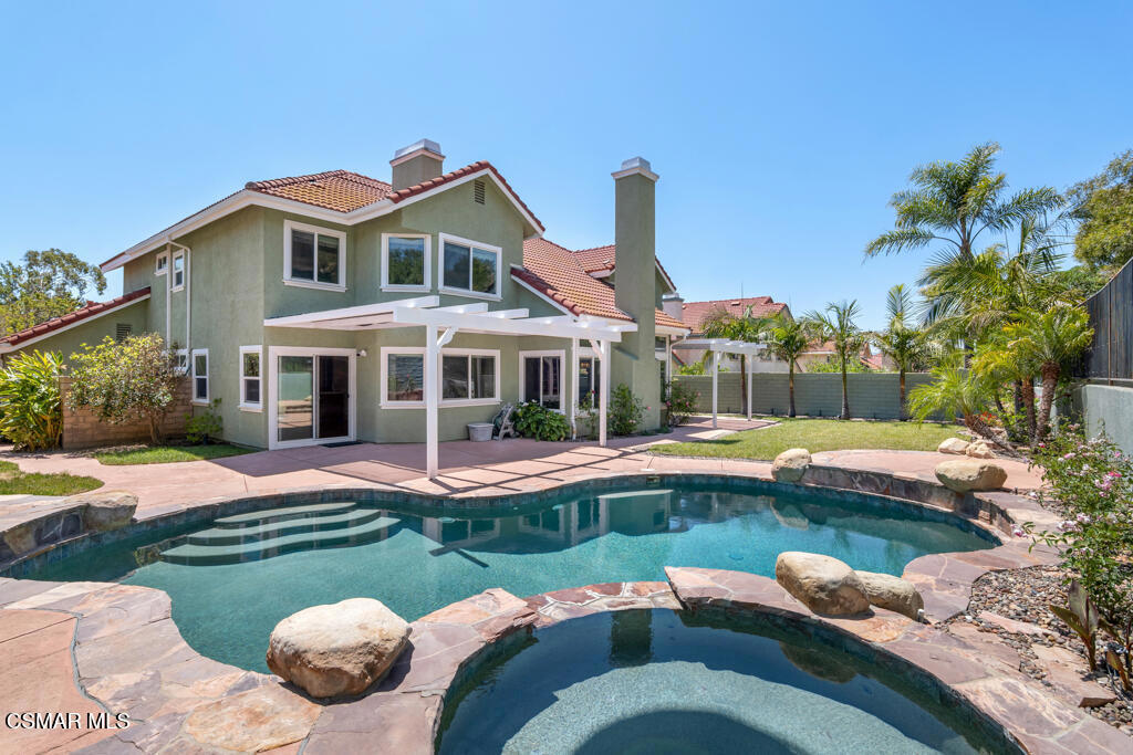 5339 Seneca Place Simi Valley, CA 93063 - Photo 61 of 76 a front view of a house with swimming pool having outdoor seating