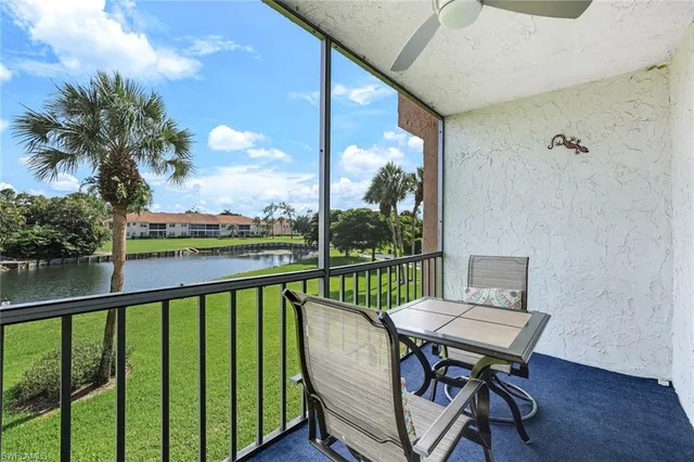 a view of a balcony with wooden floor and outdoor seating