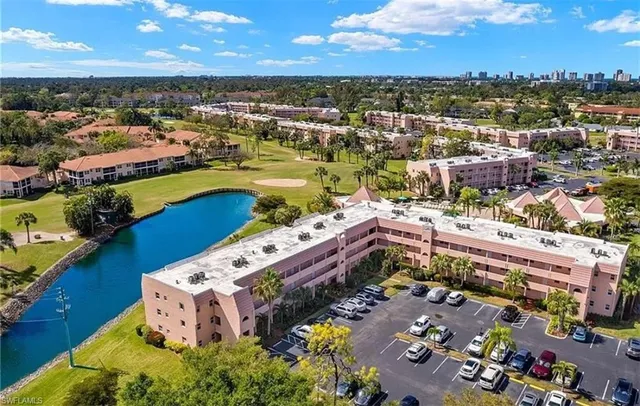 an aerial view of a house with a ocean view