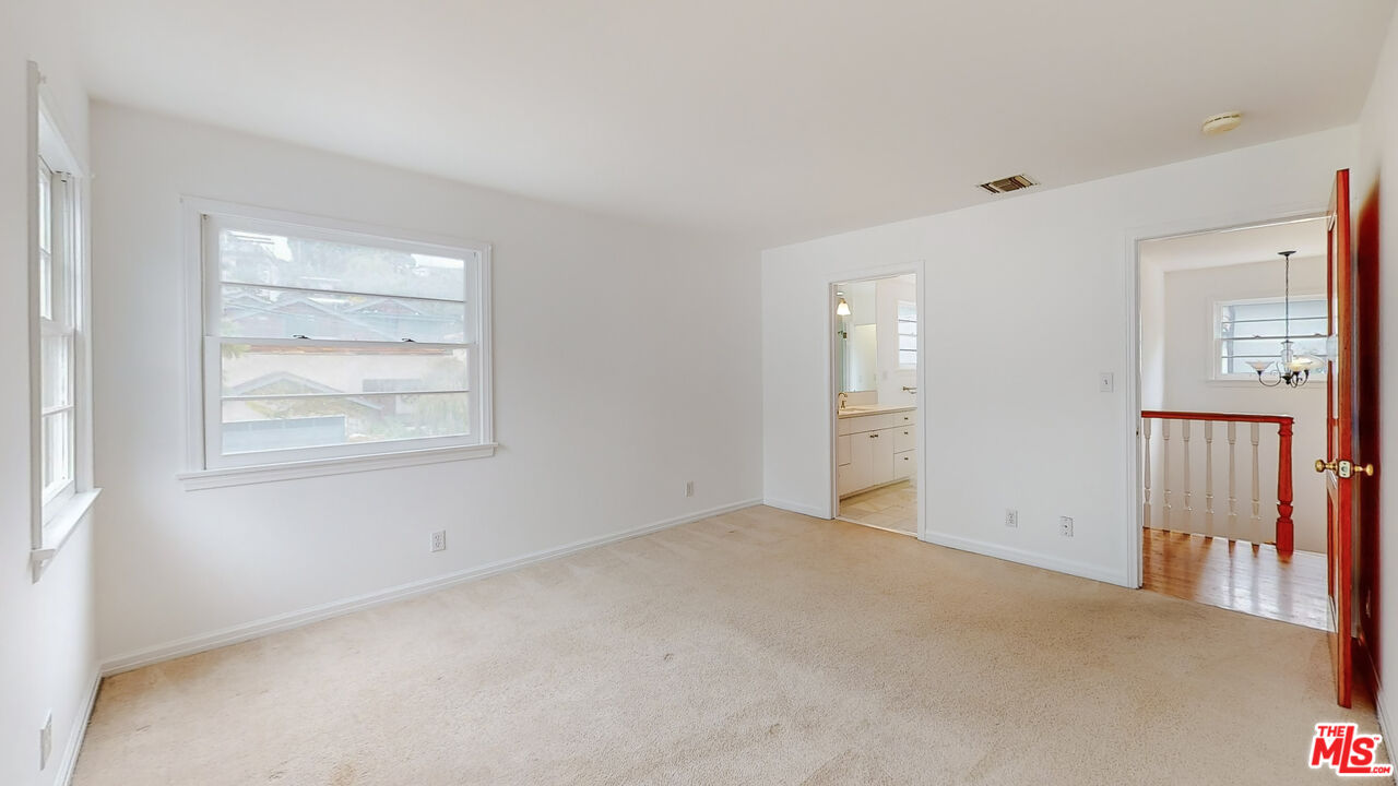 365 Sycamore Road Santa Monica, CA 90402 - Photo 18 of 42 an empty room with windows and closet