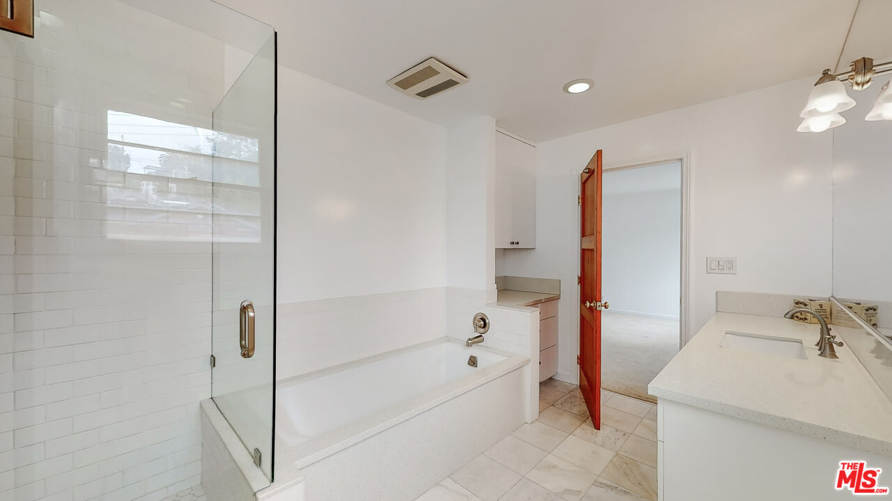 365 Sycamore Road Santa Monica, CA 90402 - Photo 22 of 42 a bathroom with a bathtub and a sink