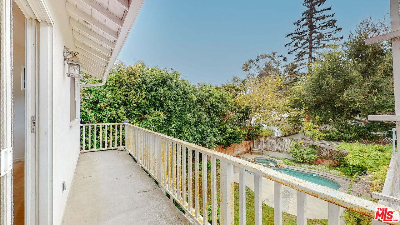 365 Sycamore Road Santa Monica, CA 90402 - Photo 27 of 42 a view of a balcony with wooden fence