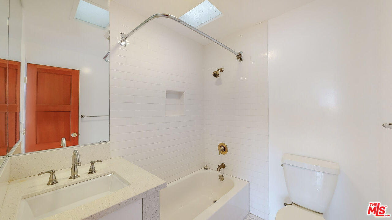 365 Sycamore Road Santa Monica, CA 90402 - Photo 29 of 42 a bathroom with a sink and a bathtub