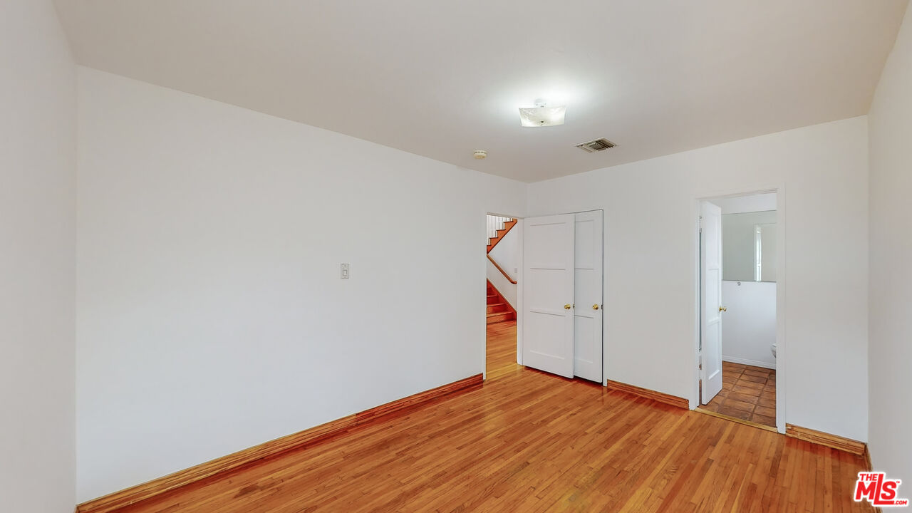 365 Sycamore Road Santa Monica, CA 90402 - Photo 30 of 42 a view of empty room with wooden floor