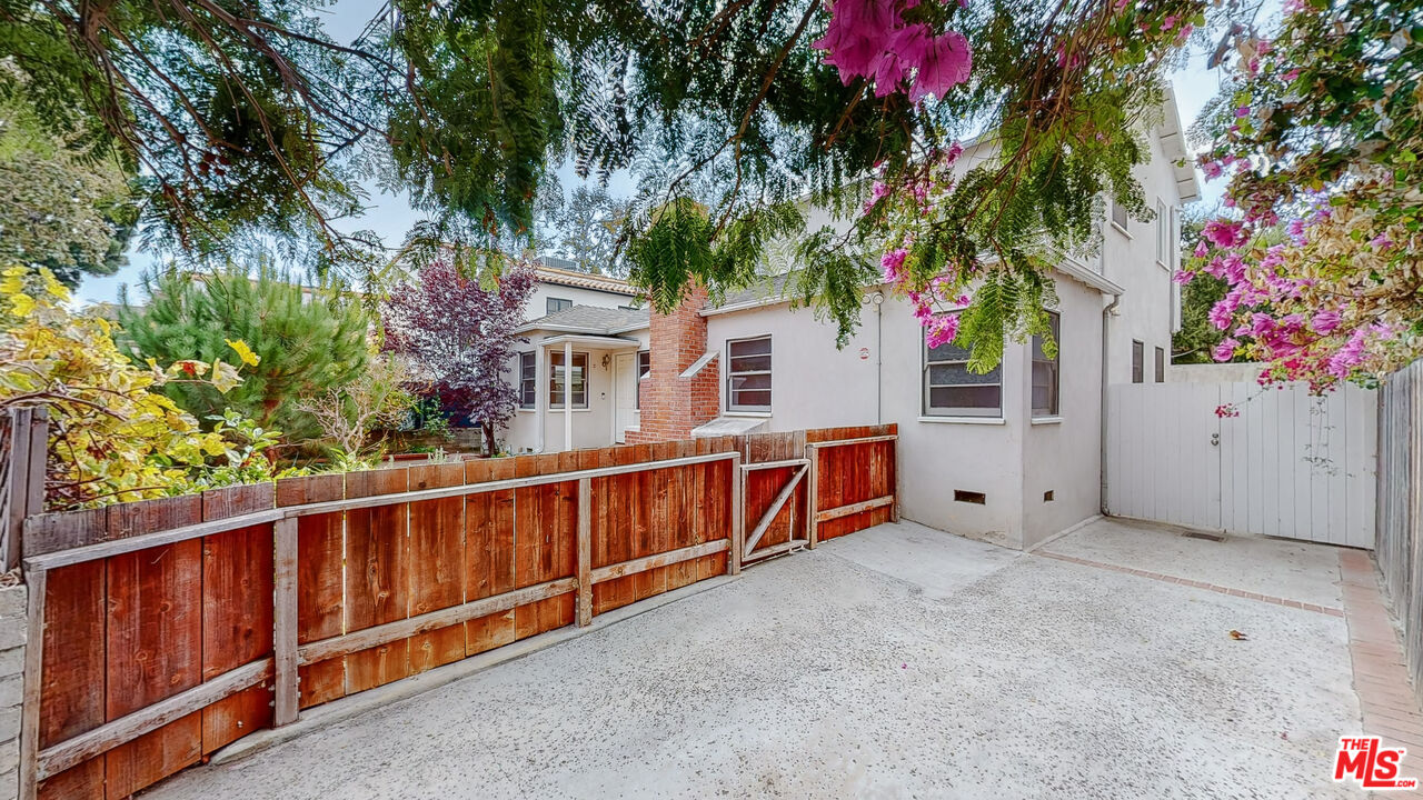 365 Sycamore Road Santa Monica, CA 90402 - Photo 3 of 42 a view of a house with wooden fence