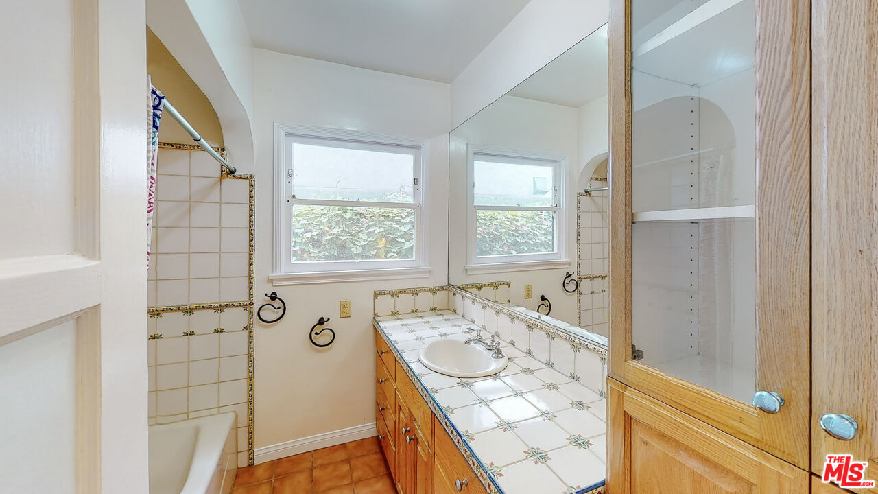 365 Sycamore Road Santa Monica, CA 90402 - Photo 31 of 42 a bathroom with a bathtub and shower
