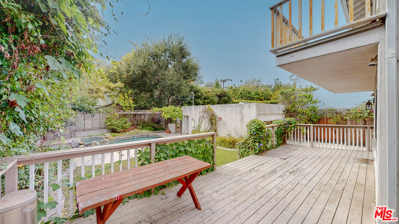 365 Sycamore Road Santa Monica, CA 90402 - Photo 32 of 42 a view of a wooden deck with a bench