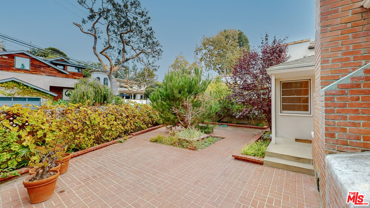 365 Sycamore Road Santa Monica, CA 90402 - Photo 4 of 42 a view of a garden with potted plants