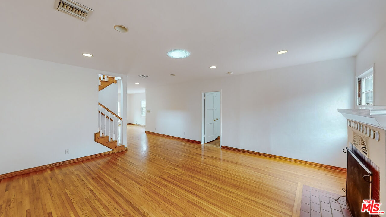 365 Sycamore Road Santa Monica, CA 90402 - Photo 6 of 42 a view of a hallway with wooden floor