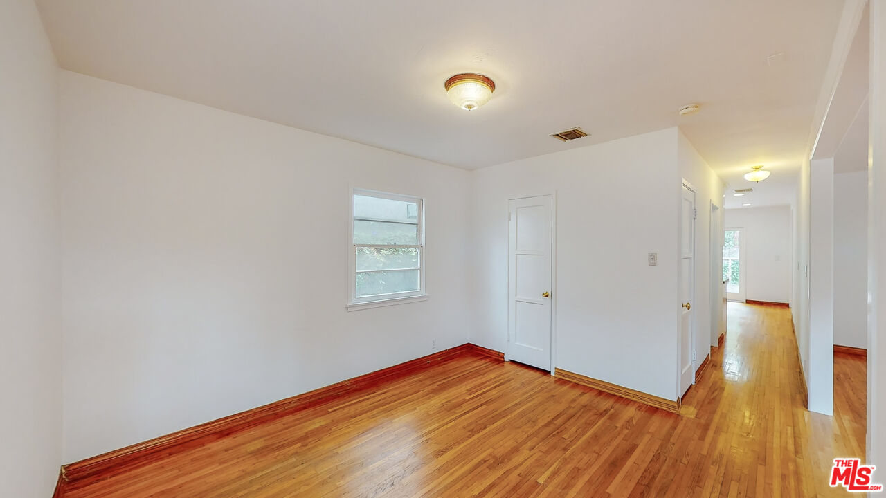 365 Sycamore Road Santa Monica, CA 90402 - Photo 10 of 42 a view of empty room with wooden floor