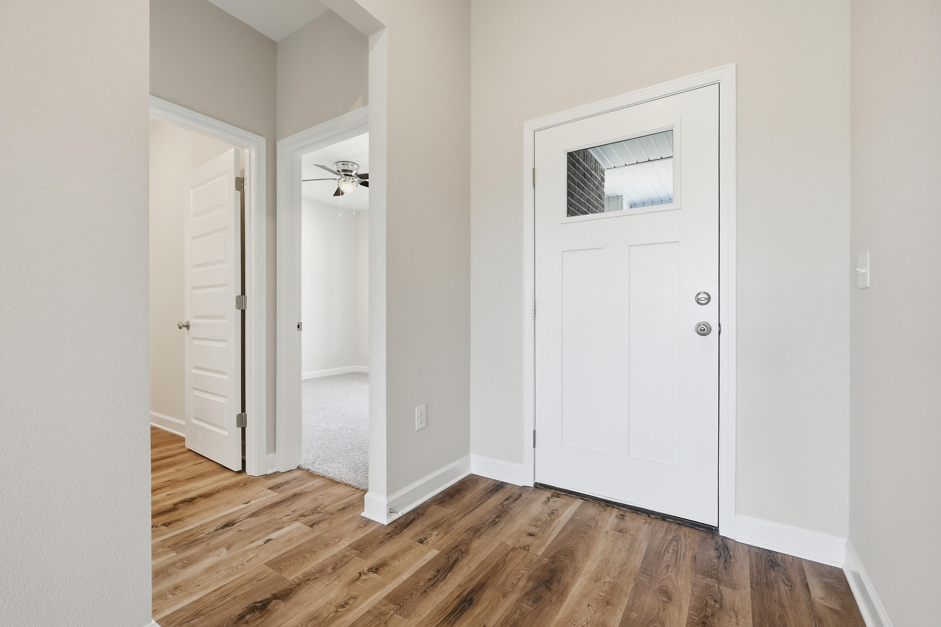 6114 Mildreds Way Crestview, FL 32539 - Photo 2 of 24 a view of a room with wooden floor