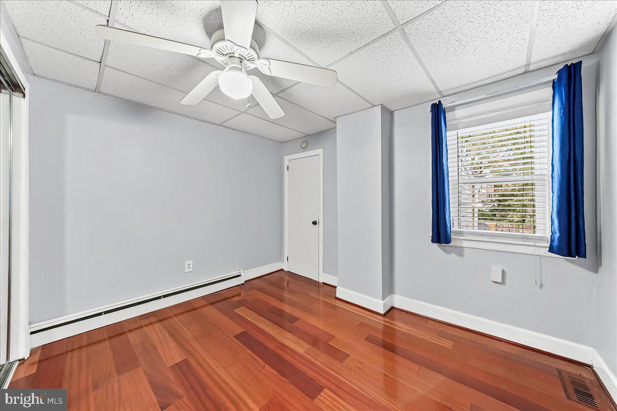 318 East 6th Avenue Conshohocken, PA 19428 - Photo 11 of 17 a view of an empty room with window and wooden floor