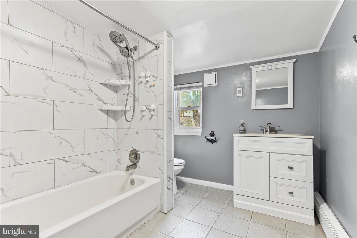 318 East 6th Avenue Conshohocken, PA 19428 - Photo 13 of 17 a bathroom with a bathtub a sink a toilet and a mirror