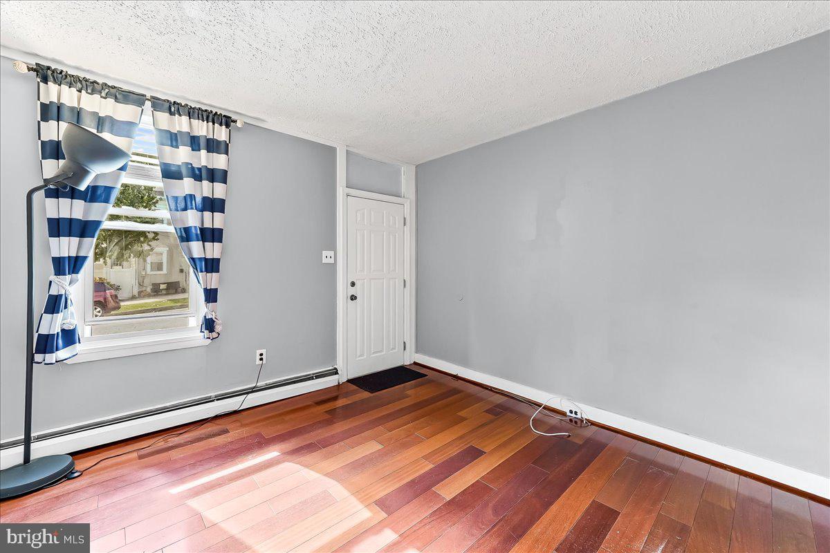 318 East 6th Avenue Conshohocken, PA 19428 - Photo 5 of 17 a view of room with window and hardwood floor