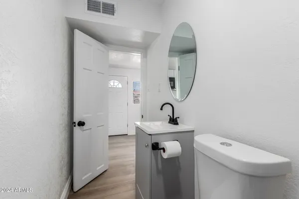 a bathroom with a toilet and a sink