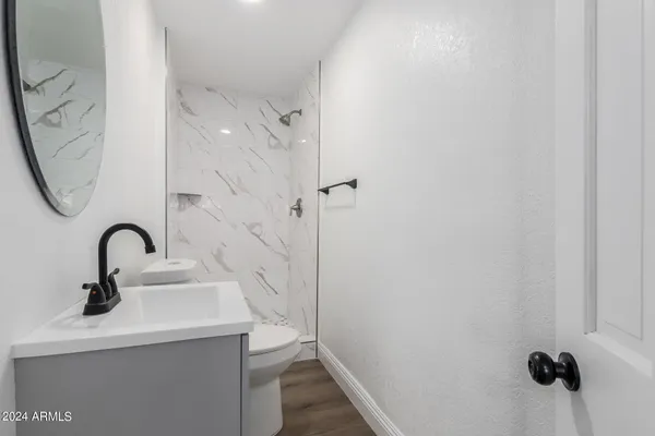 a bathroom with a sink and mirror