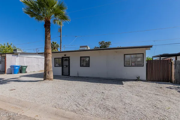 a view of a house with a yard and garage