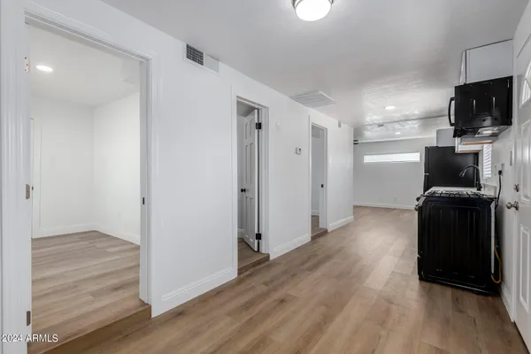 a view of a livingroom with wooden floor
