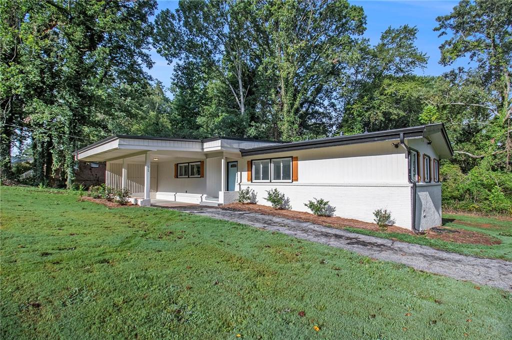1069 Longshore Drive Decatur, GA 30032 - Photo 1 of 1 a front view of house with yard and seating space