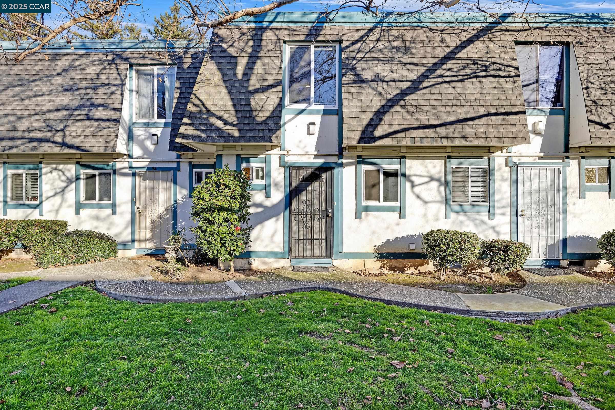 3905 Clayton Road, Unit 33 Concord, CA 94521 - Photo 1 of 1 a view of a house with a yard