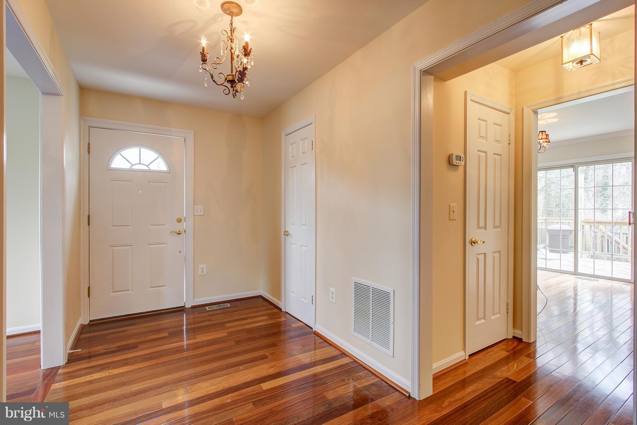 1030 Windrush Lane, Unit 31 Sandy Spring, MD 20860 - Photo 3 of 30 a view of empty room with wooden floor and fan