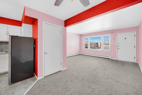 a view of an empty room with potted plants