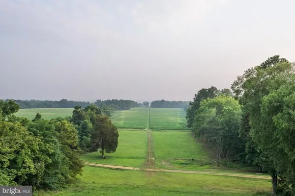 an aerial view of a houses with outdoor space